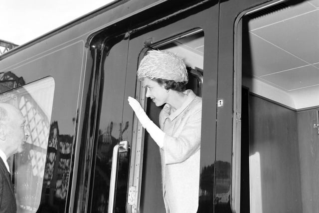 Queen Elizabeth II waves from her train at Stow Station in the Borders in July 1966.