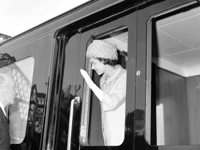 Queen Elizabeth II waves from her train at Stow Station in the Borders in July 1966.