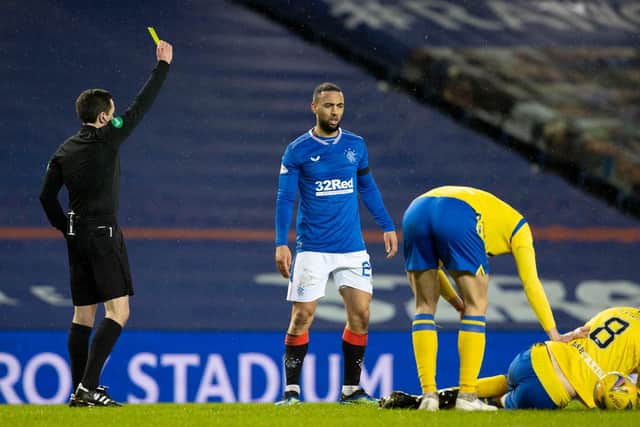 Rangers' Kemar Roofe (centre) is booked for the challenge on Murray Davidson that earned a two-match ban following an SFA review (Photo by Alan Harvey / SNS Group)