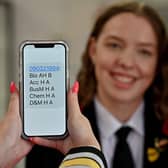 A pupil shows off her exam results during a visit by education secretary Shirley-Anne Somerville to Lochgelly High School. Picture: Jeff J Mitchell/Getty Images