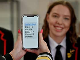 A pupil shows off her exam results during a visit by education secretary Shirley-Anne Somerville to Lochgelly High School. Picture: Jeff J Mitchell/Getty Images