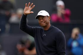 Three-time winner Tiger Woods acknowledges the crowd as he walks off the 18th green after finishing his second round in the 152nd Open at Royal Troon. Picture: Harry How/Getty Images.