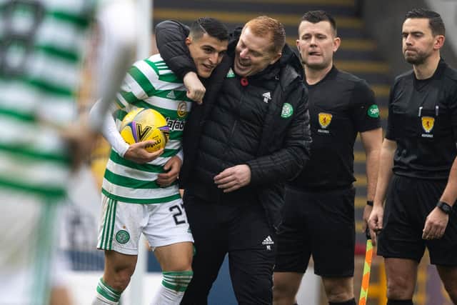 Celtic manager Neil Lennon embraces Mohamed Elyounoussi at full-time after the striker scored a hat-trick in the 4-1 win over Motherwell (Photo by Craig Williamson / SNS Group)