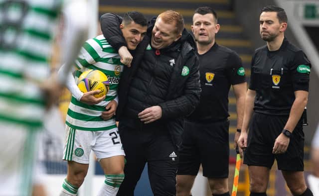 Celtic manager Neil Lennon embraces Mohamed Elyounoussi at full-time after the striker scored a hat-trick in the 4-1 win over Motherwell (Photo by Craig Williamson / SNS Group)