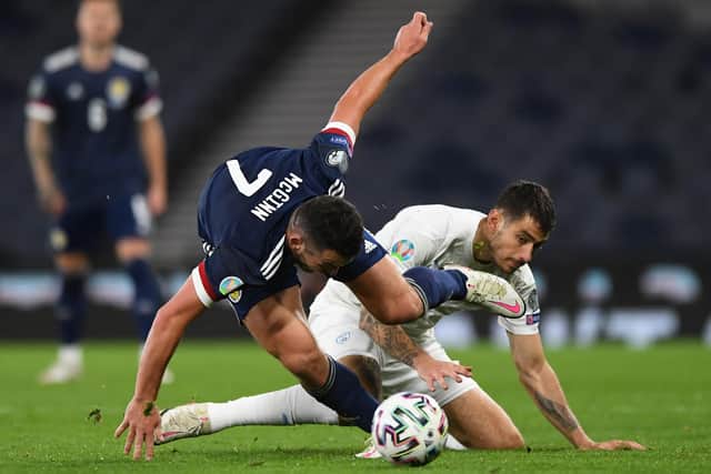 Scotland's midfielder John McGinn (L) vies with Israel's midfielder Nir Biton (R) during the Euro 2020 playoff semi-final football match between Scotland and Israel at Hampden Park, Glasgow on October 8, 2020. (Photo by ANDY BUCHANAN / AFP) (Photo by ANDY BUCHANAN/AFP via Getty Images)