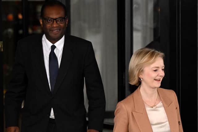 Liz Truss with Kwasi Kwarteng (Photo by Oli SCARFF / AFP)