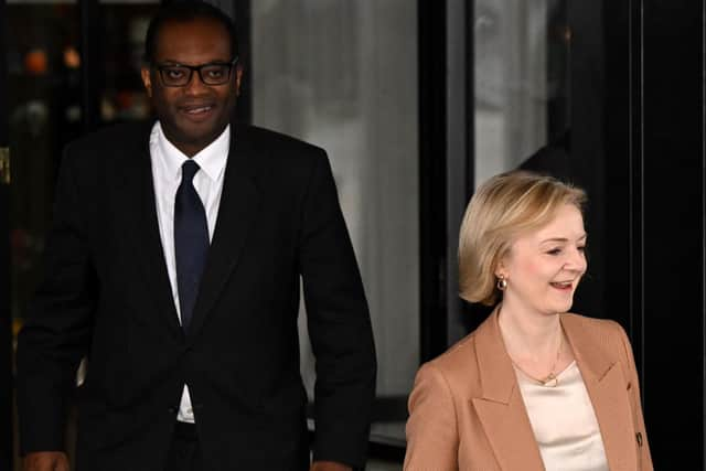 Liz Truss with  Kwasi Kwarteng (Photo by Oli SCARFF / AFP)