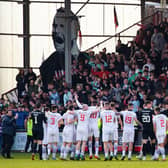 Dunfermline celebrate with their fans as they are crowned League One champions following a 5-0 win over Queen of the South.