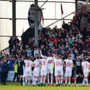 Dunfermline celebrate with their fans as they are crowned League One champions following a 5-0 win over Queen of the South.