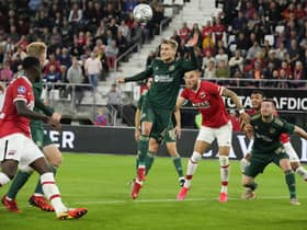 Celtic's Carl Starfelt clears the ball as AZ Alkmaar pile on pressure during the Europa League play-off second leg (AP Photo/Peter Dejong)