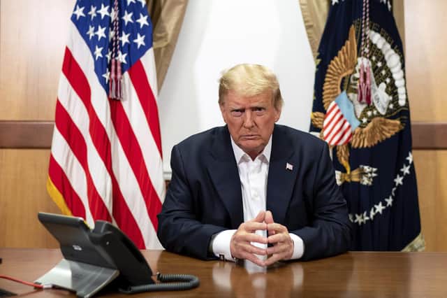 Donald Trump listens during a phone call with Vice-President Mike Pence, Secretary of State Mike Pompeo, and Chairman of the Joint Chiefs of Staff General Mark Milley in his conference room at Walter Reed National Military Medical Center (Picture: Tia Dufour/The White House via AP)
