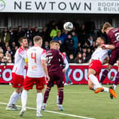 Frankie Kent heads home a late winner for Hearts against Spartans.