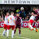 Frankie Kent heads home a late winner for Hearts against Spartans.