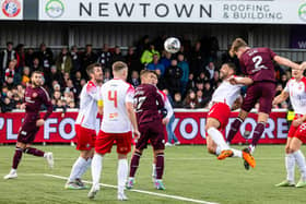 Frankie Kent heads home a late winner for Hearts against Spartans.