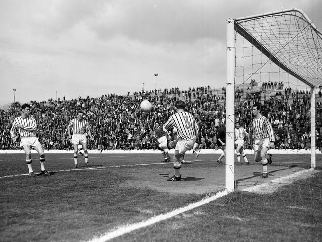 Alex Smith gets the ball and scores for Dunfermline against Hibs at Easter Road in May 1965.
