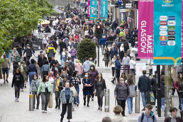 Shoppers may have been out in force in many places, including Glasgow, above, but they don't seem to have been spending as much as before.