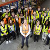 Dimensions colleagues in warehouse. Picture: Roddy Scott