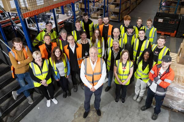 Dimensions colleagues in warehouse. Picture: Roddy Scott