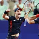 Andy Murray celebrates with partner Dan Evans after winning match point against Sander Gille and Joran Vliegen of Team Belgium during the Men's Doubles second round match at the Paris Olympics. (Photo by Clive Brunskill/Getty Images)