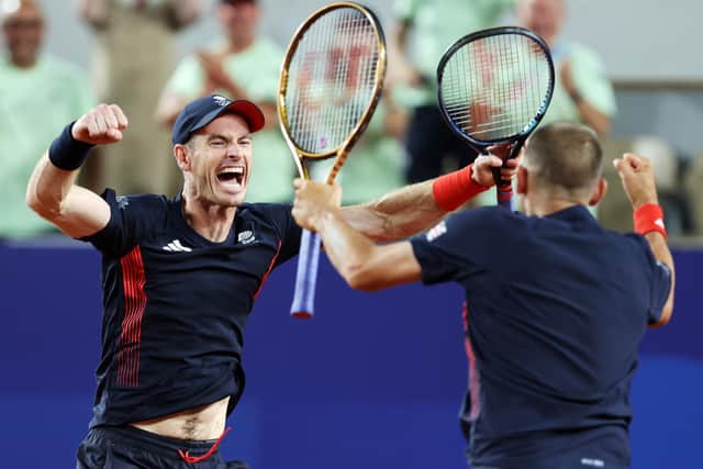 Andy Murray celebrates with partner Dan Evans after winning match point against Sander Gille and Joran Vliegen of Team Belgium during the Men's Doubles second round match at the Paris Olympics. (Photo by Clive Brunskill/Getty Images)