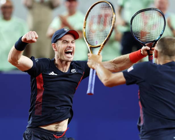 Andy Murray celebrates with partner Dan Evans after winning match point against Sander Gille and Joran Vliegen of Team Belgium during the Men's Doubles second round match at the Paris Olympics. (Photo by Clive Brunskill/Getty Images)