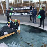 Extinction Rebellion protesters gathered outside the Scottish Parliament, with two activists dressing as an MSP and BP respectively, in order to criticise the 'overly cosy relationship between the company and decision-makers'.