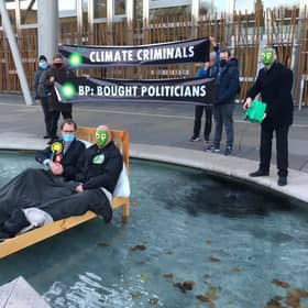 Extinction Rebellion protesters gathered outside the Scottish Parliament, with two activists dressing as an MSP and BP respectively, in order to criticise the 'overly cosy relationship between the company and decision-makers'.