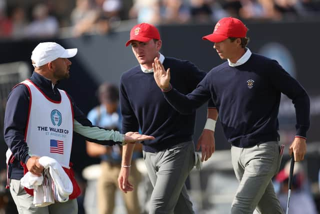 World No 1 Gordon Sargent, right, celebrates with his caddie Alan Tulleth from St Andrews. Picture: Oisin Keniry/R&A/R&A via Getty Images.