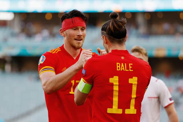 Gareth Bale congratulates Kieffer Moore after his goal earned Wales a draw with Switzerland