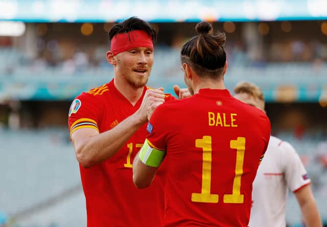 Gareth Bale congratulates Kieffer Moore after his goal earned Wales a draw with Switzerland