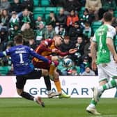 Motherwell's Blair Spittal is brought down in the box by Hibs goalkeeper David Marshall. Photo by Craig Foy / SNS Group