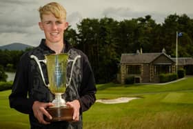 Elgin's Billy Devine shows off the trophy after winning the Scottish Boys' Championship at Lanark. Picture: Scottish Golf