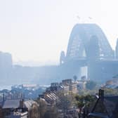 The Sydney Harbour Bridge is seen shrouded by smoke in Sydney after a ring of controlled blazes burned on the city's fringes in preparation for the looming bushfire season.