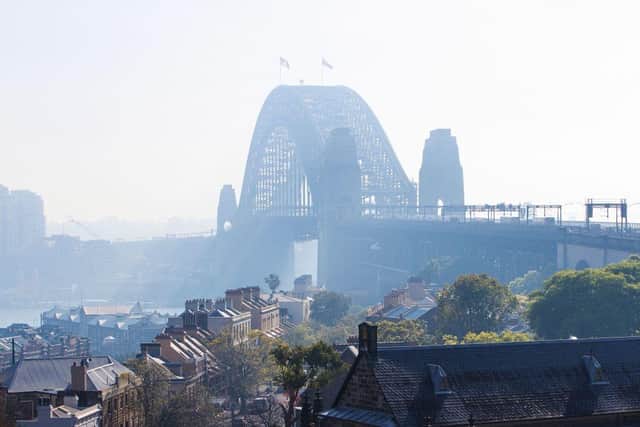 The Sydney Harbour Bridge is seen shrouded by smoke in Sydney after a ring of controlled blazes burned on the city's fringes in preparation for the looming bushfire season.