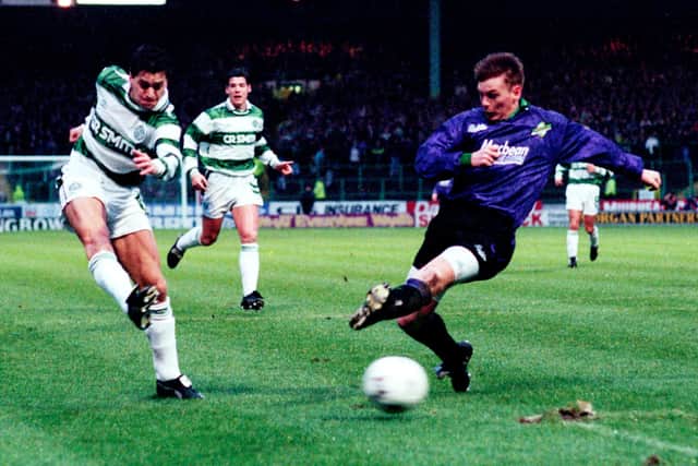Pat McGinlay playing for Celtic against Hibs' Gordon Hunter.