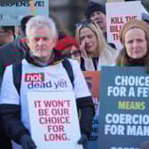 People take part in a demonstration at Old Palace Yard in Westminster, London, to oppose the Terminally Ill Adults (End of Life) Bill. PIC: Yui Mok/PA Wire