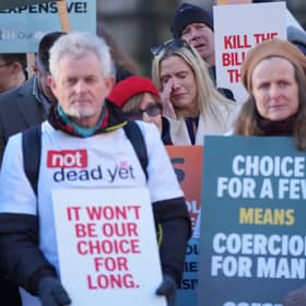 People take part in a demonstration at Old Palace Yard in Westminster, London, to oppose the Terminally Ill Adults (End of Life) Bill. PIC: Yui Mok/PA Wire