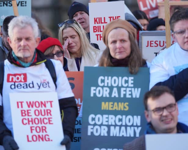 People take part in a demonstration at Old Palace Yard in Westminster, London, to oppose the Terminally Ill Adults (End of Life) Bill. PIC: Yui Mok/PA Wire