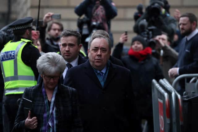 Former Scottish first minister Alex Salmond (centre) leaving the High Court in Edinburgh, on the first day of his trial over accusations of sexual assault, including one of attempted rape.