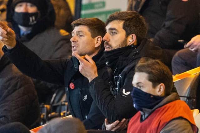 Rangers manager Steven Gerrard, seated beside analyst Scott Mason, watches from the stand after being sent off by referee John Beaton at half-time of his team's 1-0 win at Livingston. (Photo by Alan Harvey / SNS Group)
