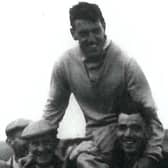 Fans carry golfing legend Stuart Murray off the course after a famous victory