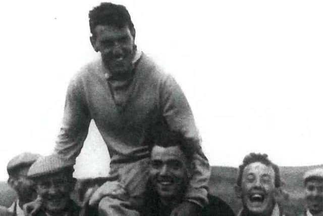 Fans carry golfing legend Stuart Murray off the course after a famous victory