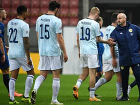 Scotland manager Steve Clarke shakes hands with his players after Sunday's defeat. Picture: PA