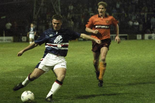 Player-manager Simon Stainrod (left) scores while wearing Dundee's "Sampdoria" kit in a 3-1win over Motherwell at Fir Park in November 1992