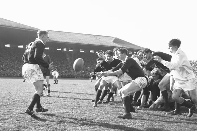 Scotland's Jim Telfer passes to a team mate during the Five Nations Scotland v England match at Murrayfield in 1966.