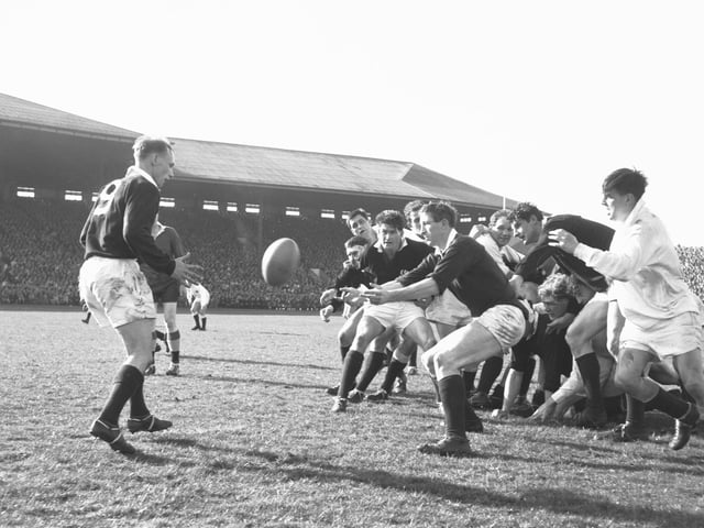Scotland's Jim Telfer passes to a team mate during the Five Nations Scotland v England match at Murrayfield in 1966.