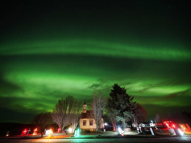 The northern lights over Villingaholtskirkja Church on the south coast of Iceland. Picture date: Sunday November 27, 2022. PA Photo. Photo credit should read: Owen Humphreys/PA Wire