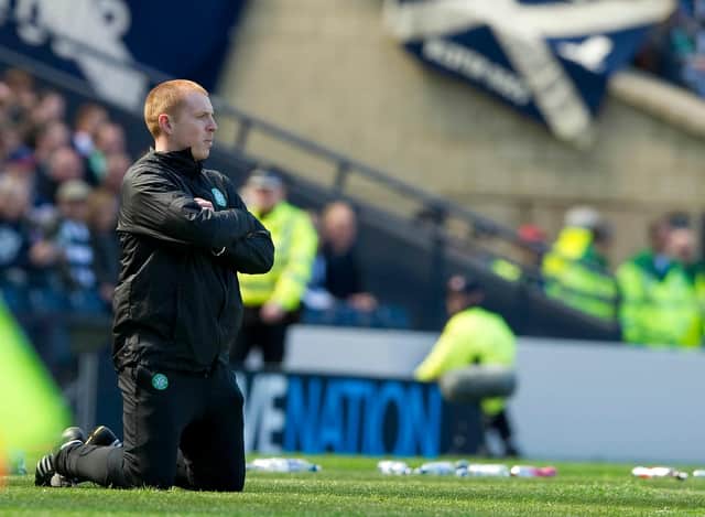 Neil Lennon drops to his knees as he looks on during the semi-final loss
