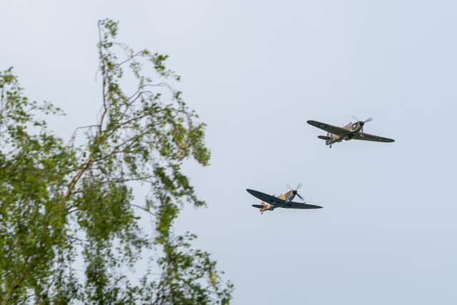 A Battle of Britain Memorial Flight flypast of a Spitfire and a Hurricane passes over the home of Captain Tom Moore as he celebrates his 100th birthday.