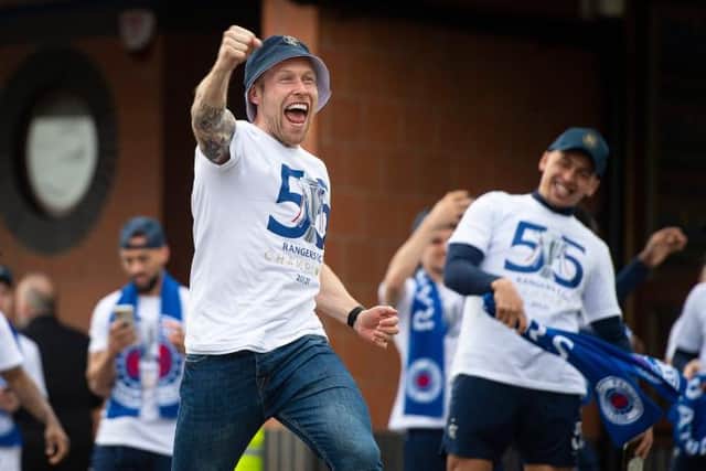 Scott Arfield celebrating at the Rangers training ground last week after the Ibrox club were confirmed as the new Scottish Premiership champions. (Photo by Ross MacDonald / SNS Group)